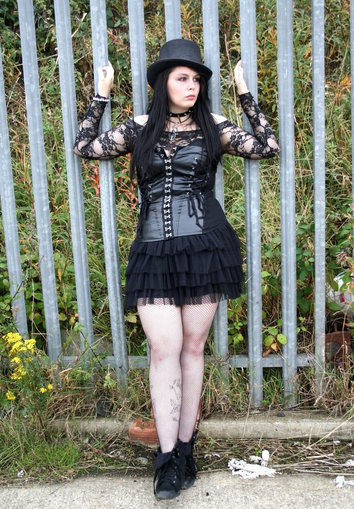 Brunette Gothic Teen Girl wearing Black Fishnet Pantyhose and Black Short Dress